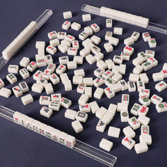 TIASUSAN dice and wind indicator included with travel Mahjong set.