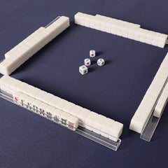 TIASUSAN mahjong manual and four blank spares for gameplay reference.