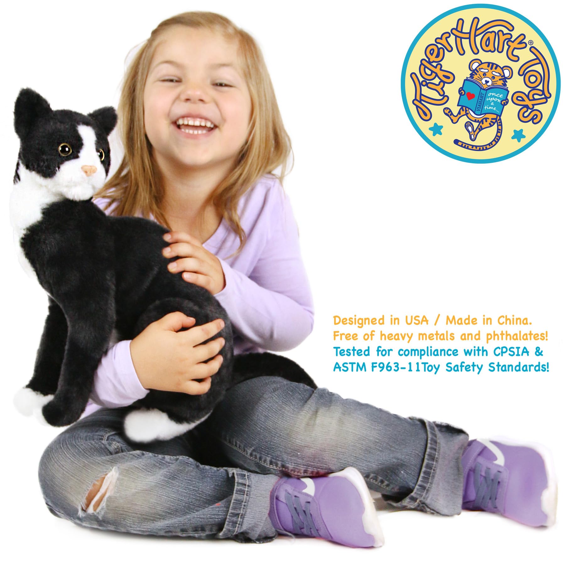 TigerHart Tate tuxedo cat plush, side profile, classic black-and-white display piece.