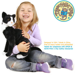 TigerHart Tate tuxedo cat plush, side profile, classic black-and-white display piece.