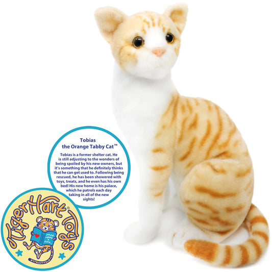 TigerHart Tobias orange tabby plush top view illustrating compact 9 by 6.5 by 12.5 inch size for hugs.