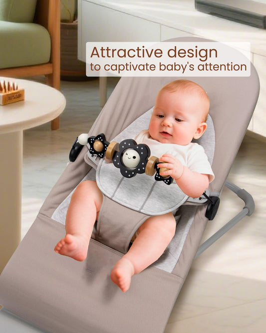TinlyFinly toy bar clip attachment demonstrates tight grip on bouncer frames for secure use