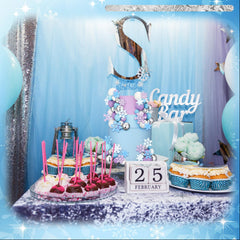 Tioncy varied sizes of snowflakes and balls help create a balanced cake display.
