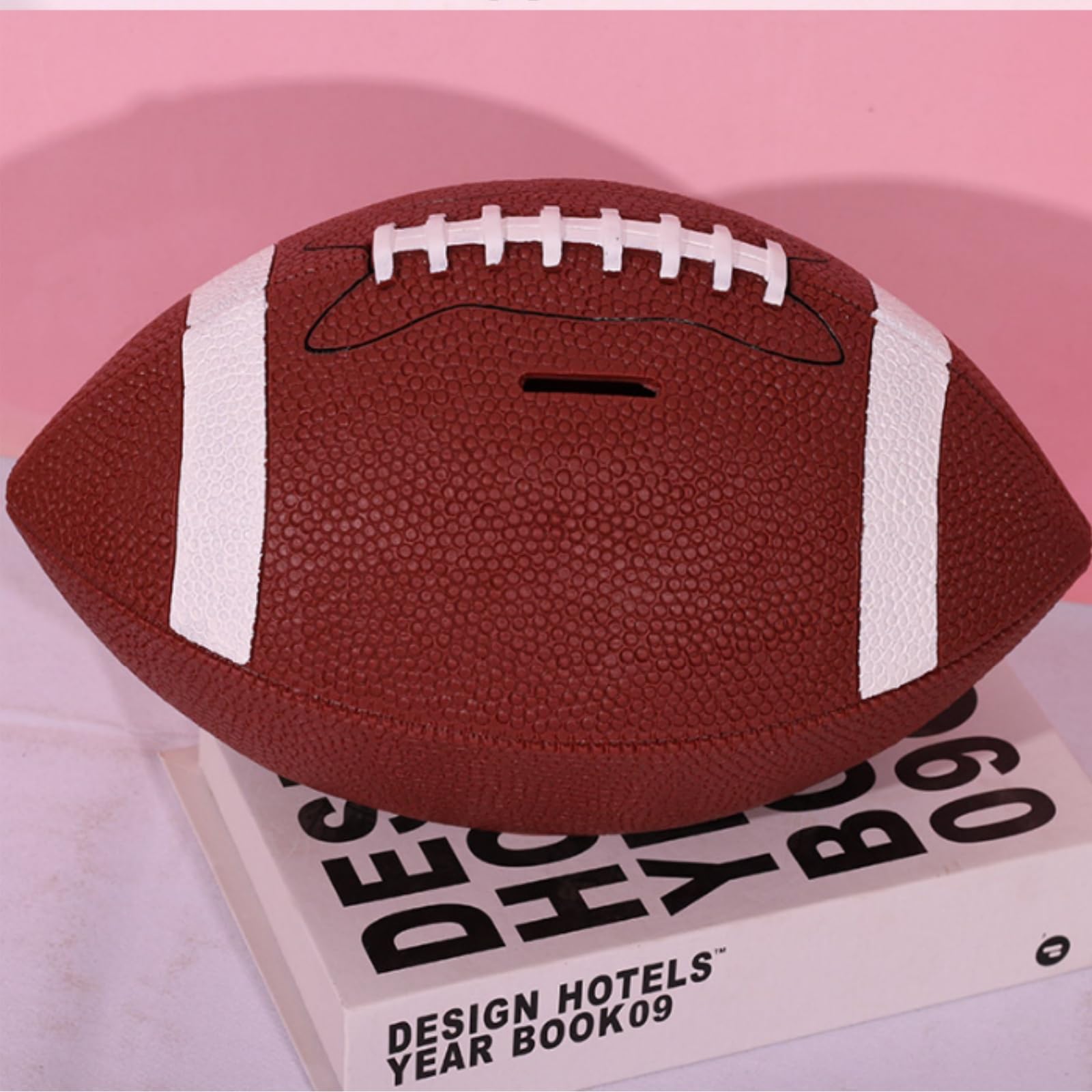 Tlence football bank showcases shatterproof material for lasting use.