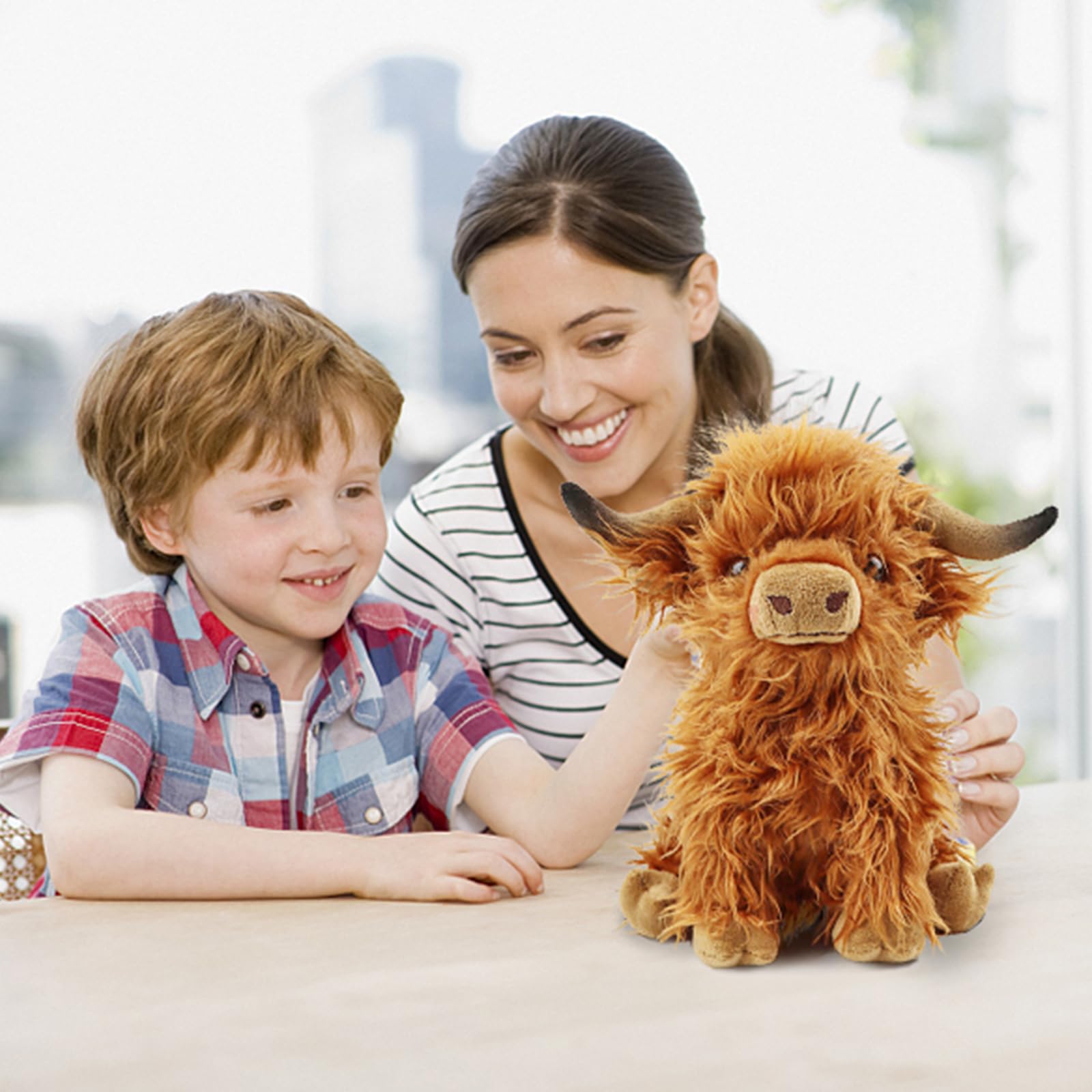 Toaje Highland Cow cuddle buddy invites kids to snuggle and imagination.