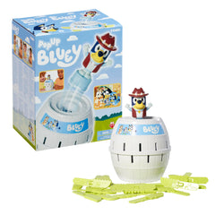 Box contents of TOMY Pop Up Bluey: barrel, figure, and sticks.