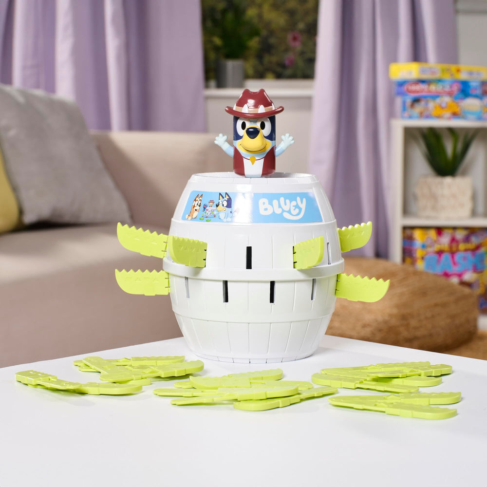 TOMY Pop Up Bluey game in action as Bluey pops from the barrel.