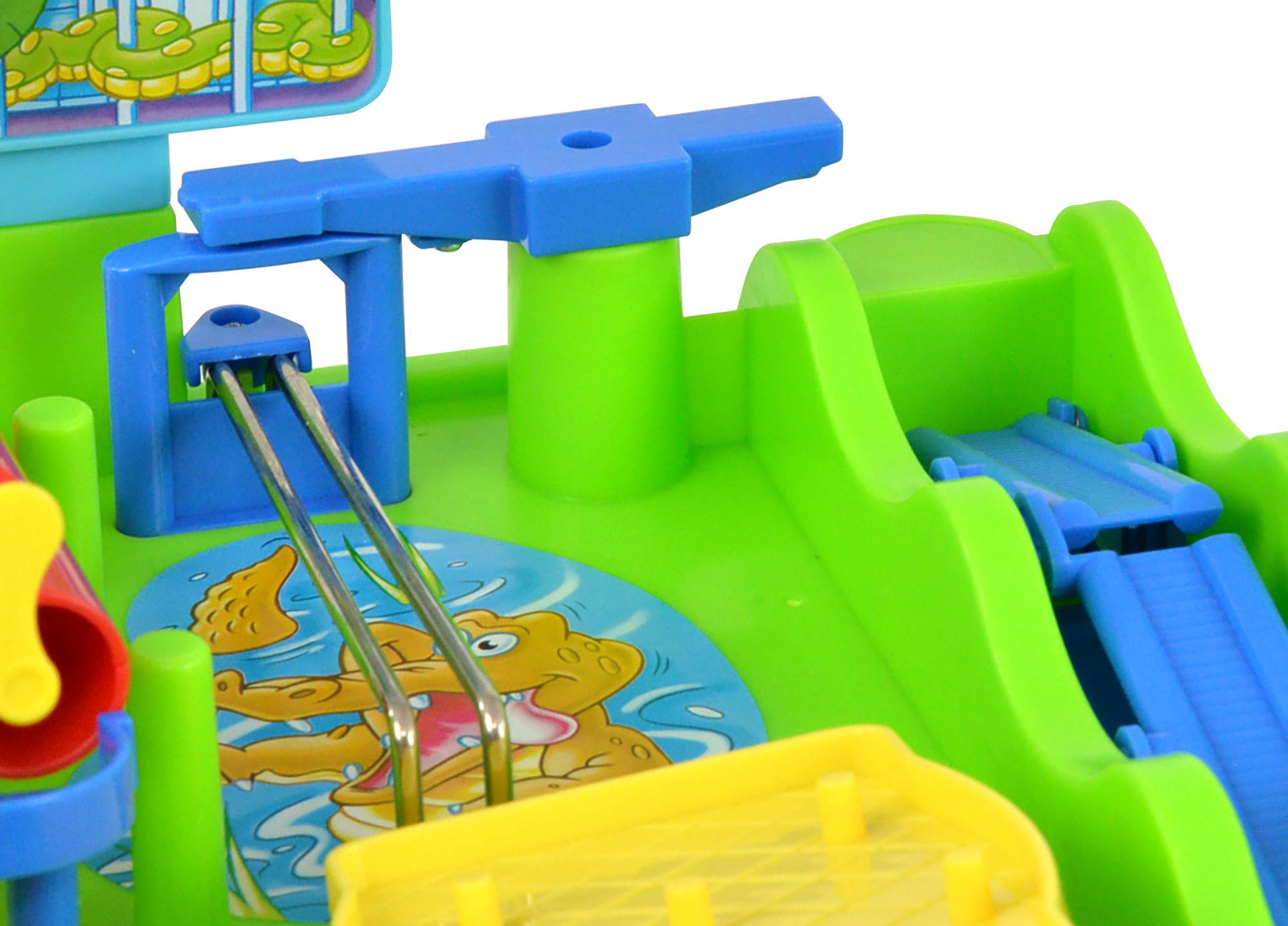 TOMY game on tabletop next to a soda can showing compact size and portability