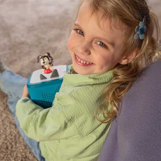 Playtime Puppy Tonie resting on Tropical Teal Toniebox for storytime adventures