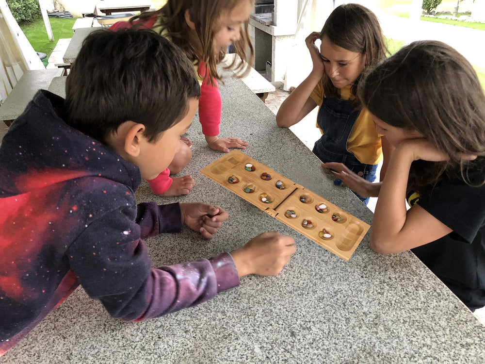 TOWO Mancala instruction card visible for quick learning and setup