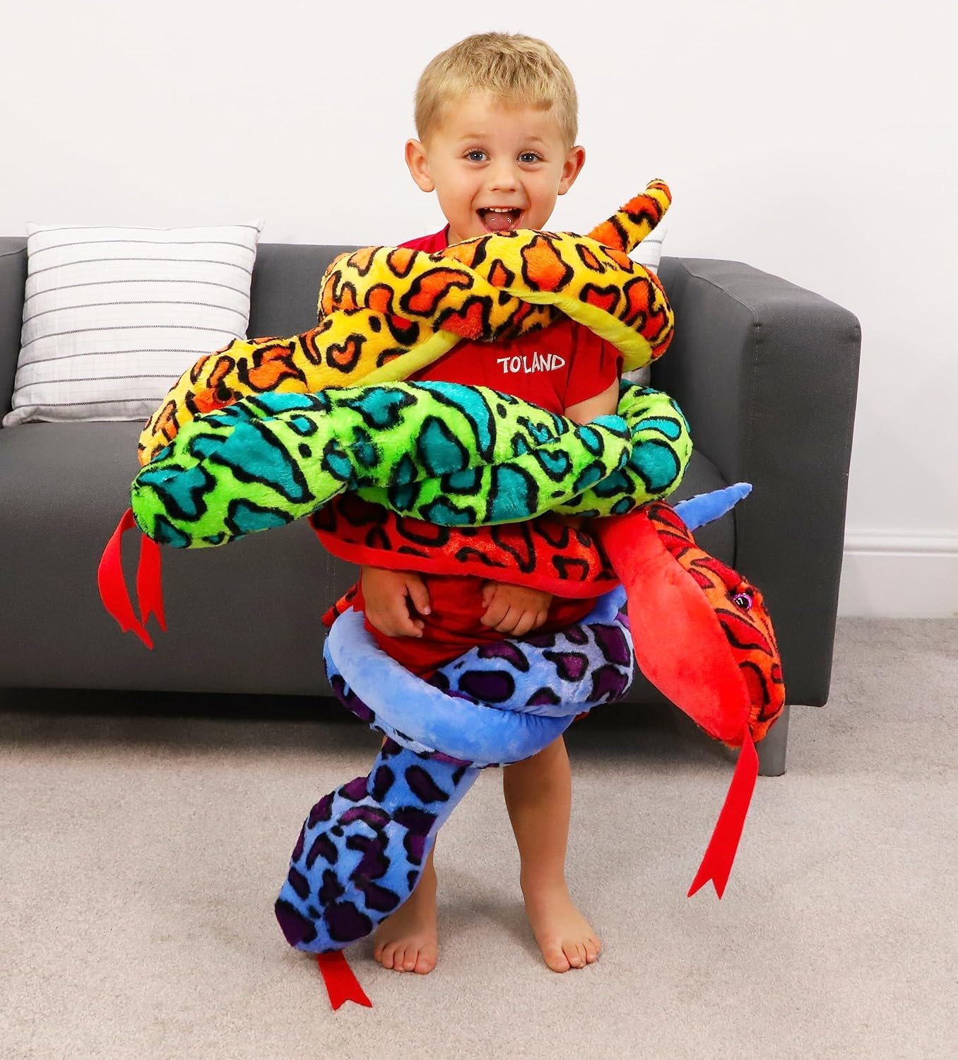 Toyland plush snake draught excluder use helps warm rooms.
