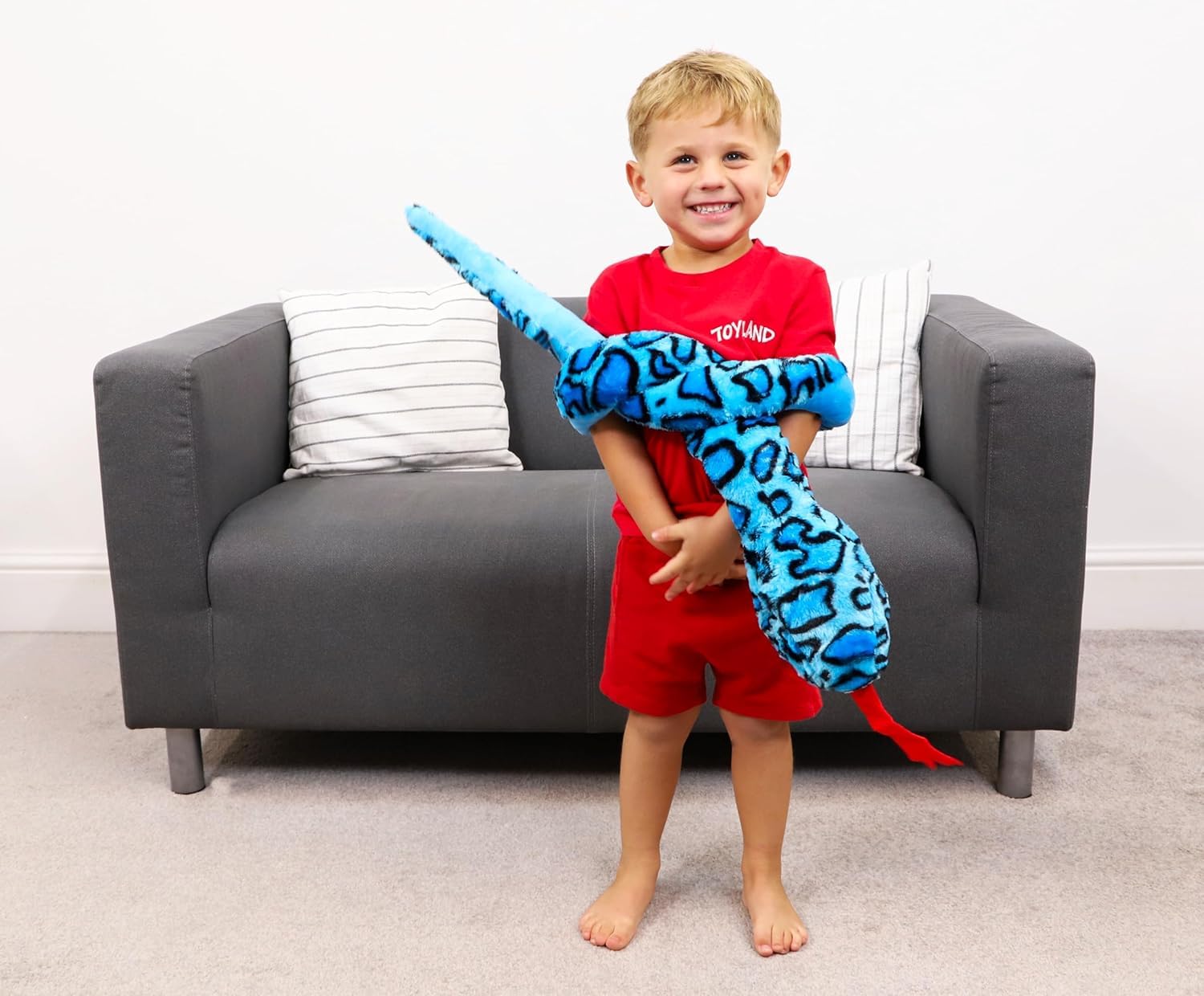 Toyland giant snake draught excluder use helps warm up a room.