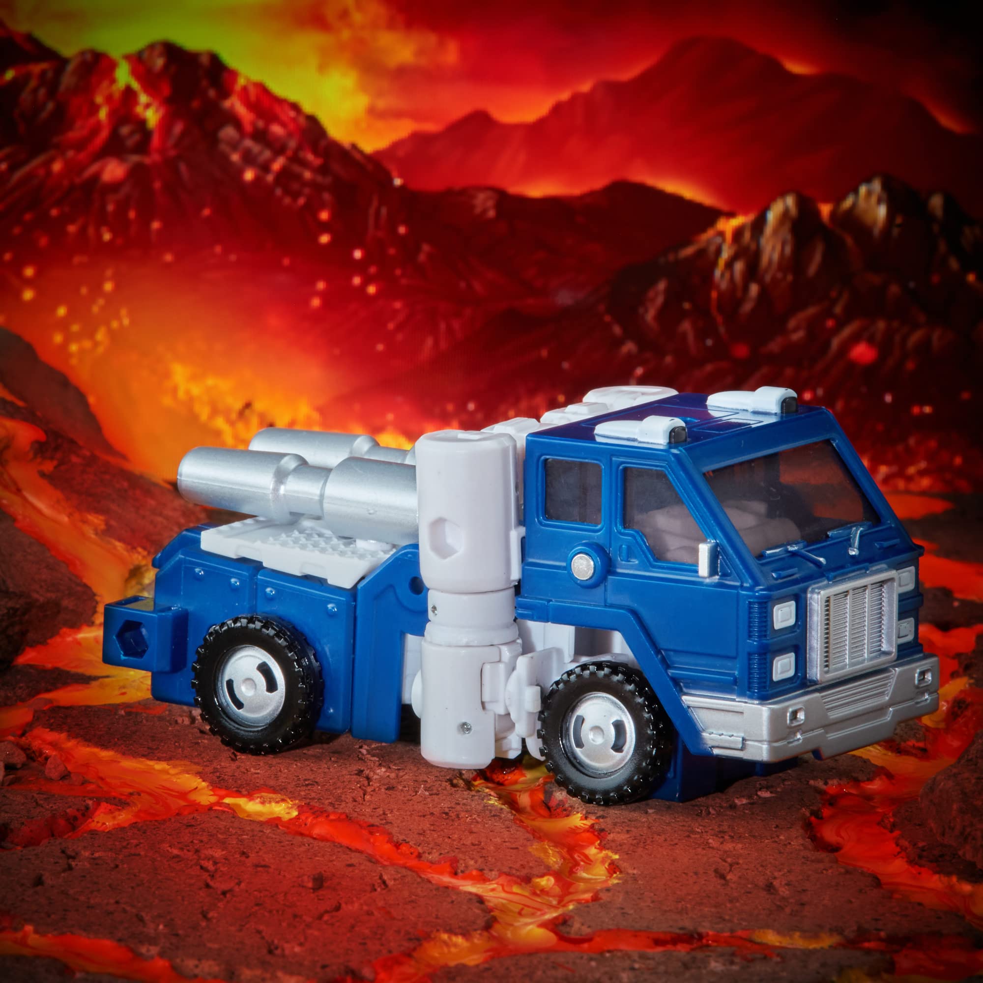 Transformers Kingdom Autobot Pipes translucent windows highlight retro styling.