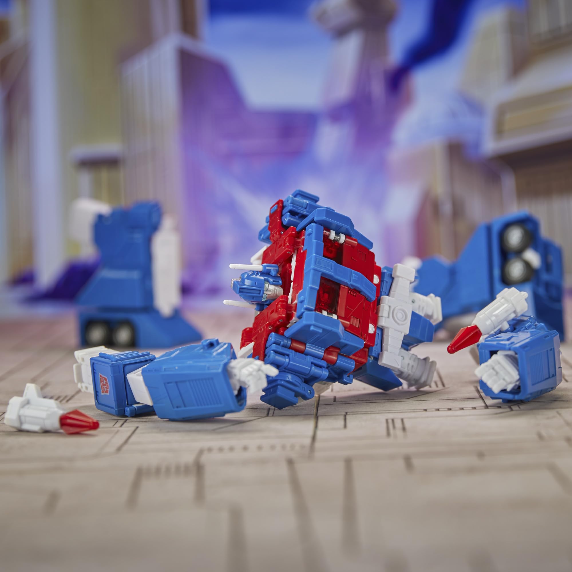Backdrop of Battle of Autobot City enhances cinematic display.