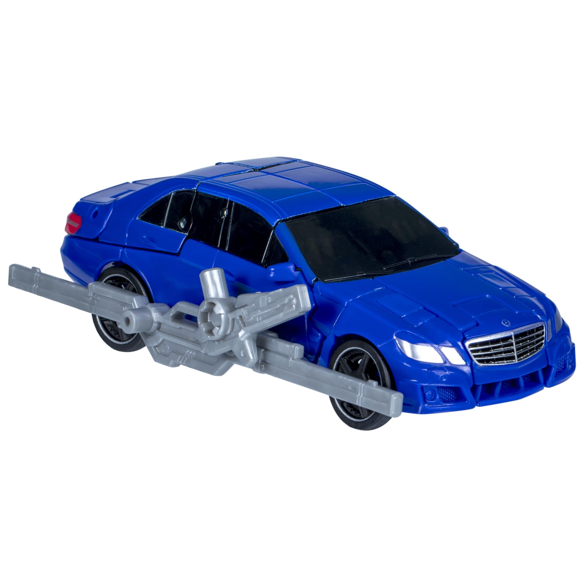 Wheeljack Que blaster accessory attaches for authentic display and action.