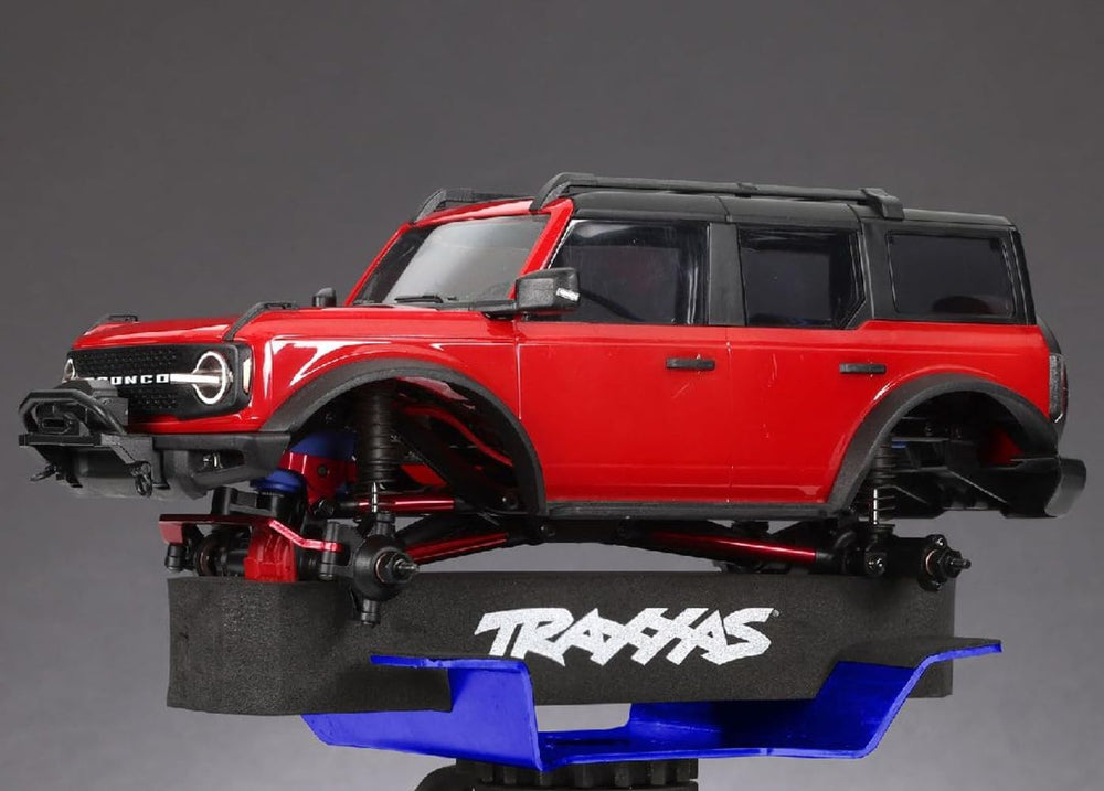 Traxxas 8796 blue RC stand deployed on a workbench for quick maintenance.