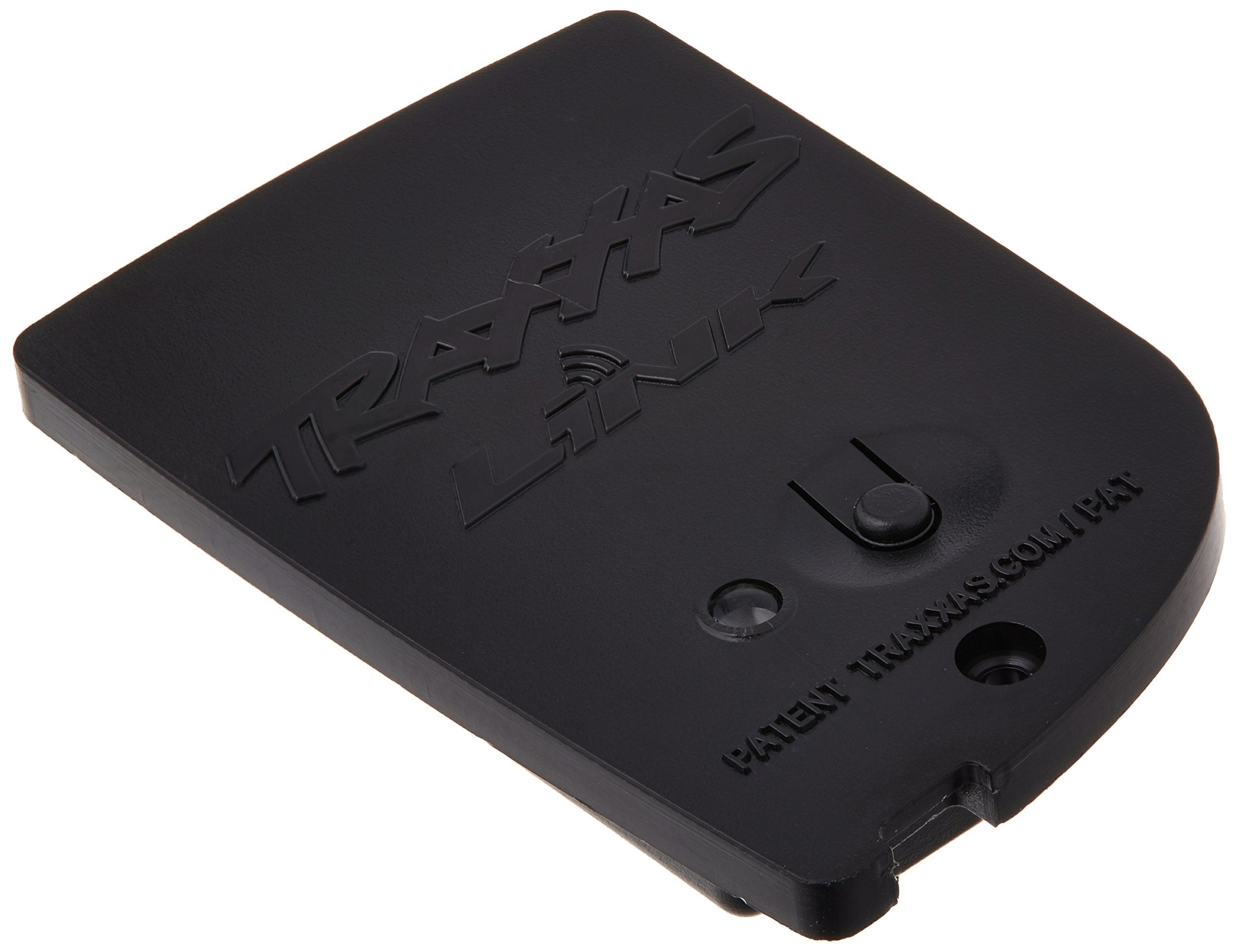 Traxxas TQi Link wireless module paired with a smartphone for real-time tuning.