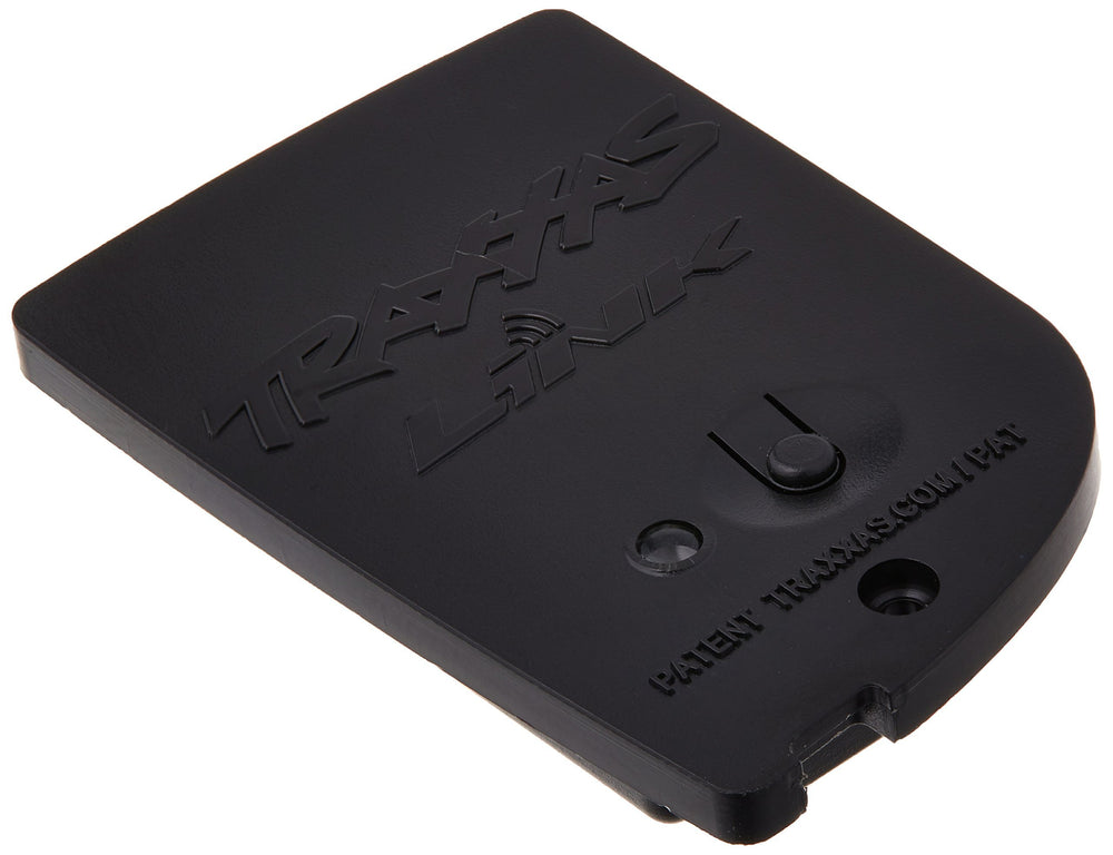 Traxxas TQi Link wireless module paired with a smartphone for real-time tuning.