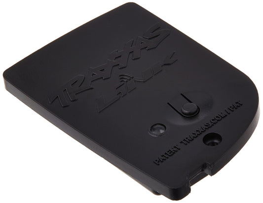 Traxxas TQi Link wireless module paired with a smartphone for real-time tuning.