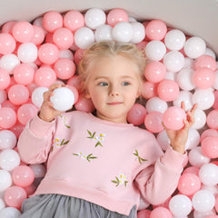 TrendBox ball pit balls filling a small play pit with bright hues.
