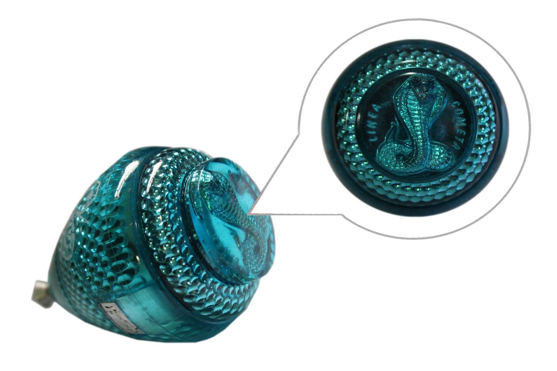 Trompo Cometa Cobrita open-string storage design for quick string replacement.