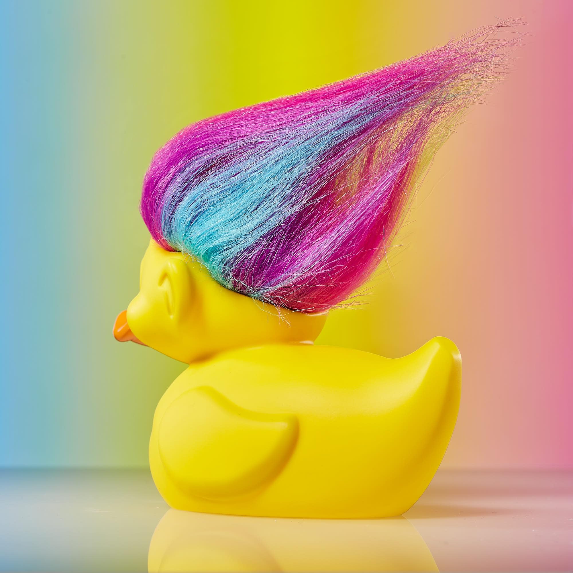TUBBZ Rainbow Troll 9 cm tall, compact shelf-friendly presence.