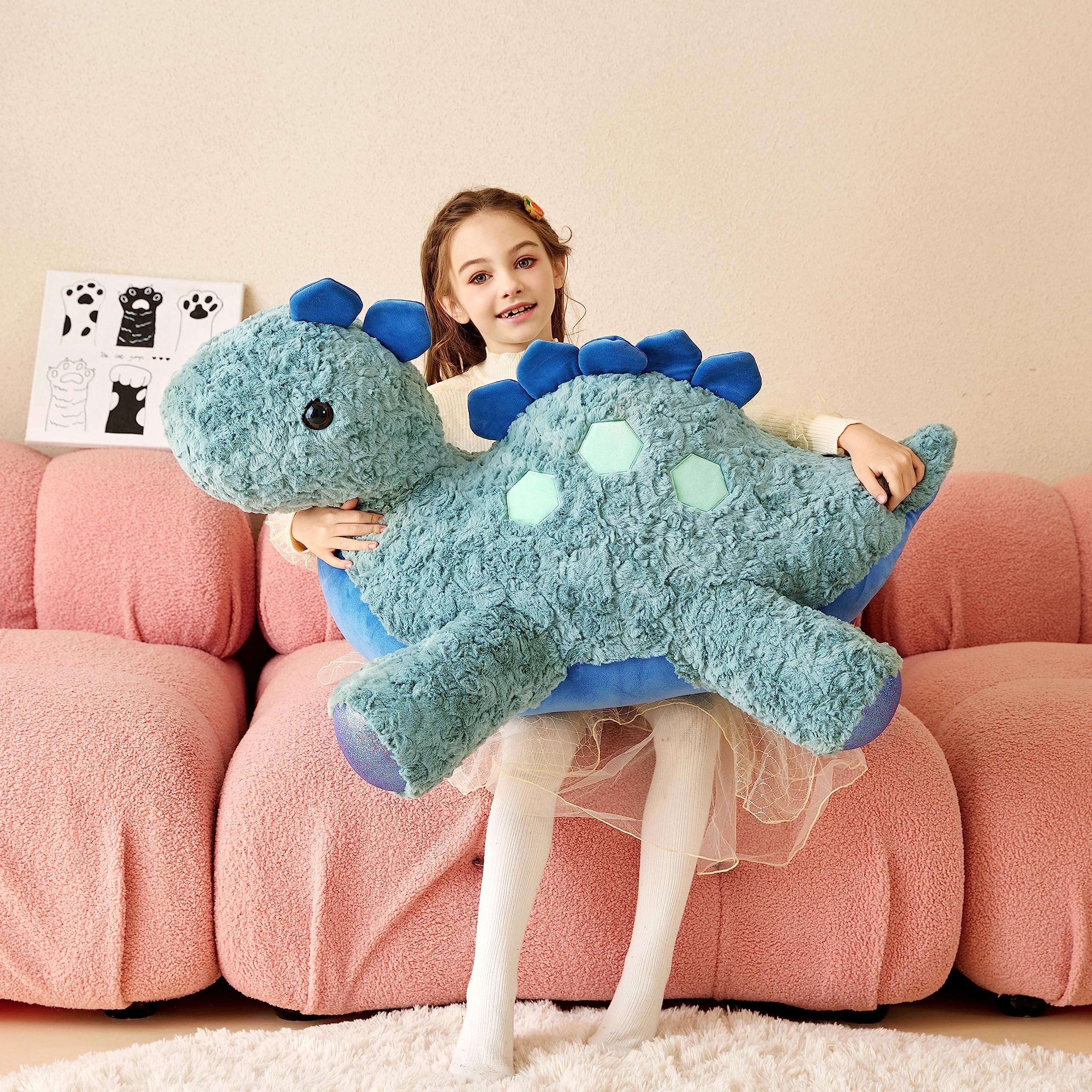 Tumyay Giant Stegosaurus Plush being hugged by a child demonstrates comfort and companionship.