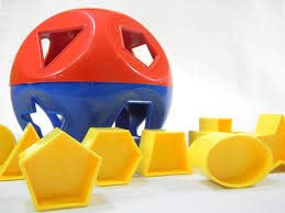 Tupperware Shape-O ball closed with colorful shapes inside, supports early shape sorting.