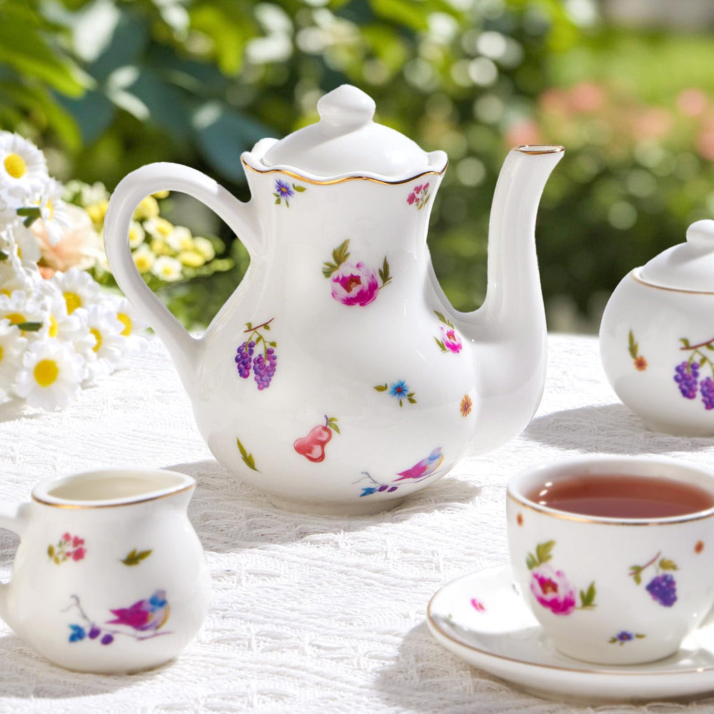 TUZT sugar bowl with lid showing fruit and flower motifs for sweet tea moments.
