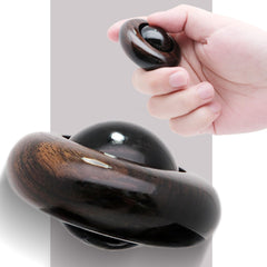 Tybasthe UFO roller in hand for tactile focus and stress relief