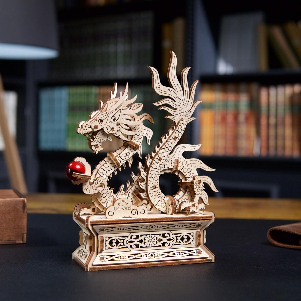 UGEARS Wood Dragon Puzzle kit during build session with family