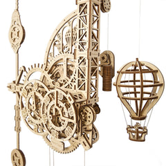 UGEARS Aero Clock packaging with wooden parts ready for assembly.