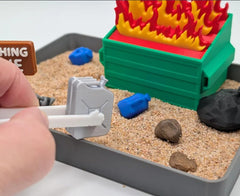 UglaForge Dumpster Fire Zen Garden from above, compact desk accent for focus.