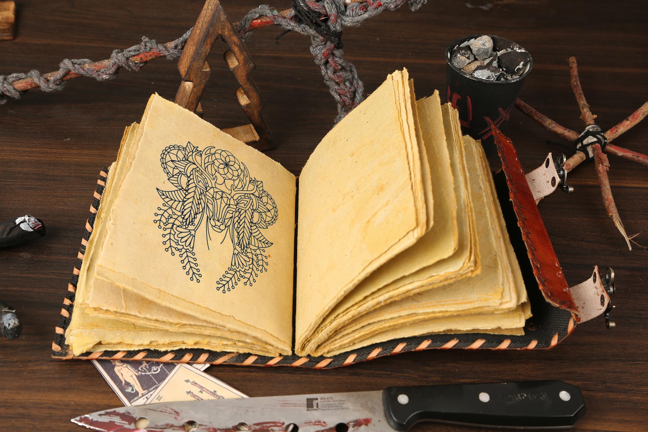ULCH spellbook with keepsake clasp suggesting secure storage for rituals and ideas