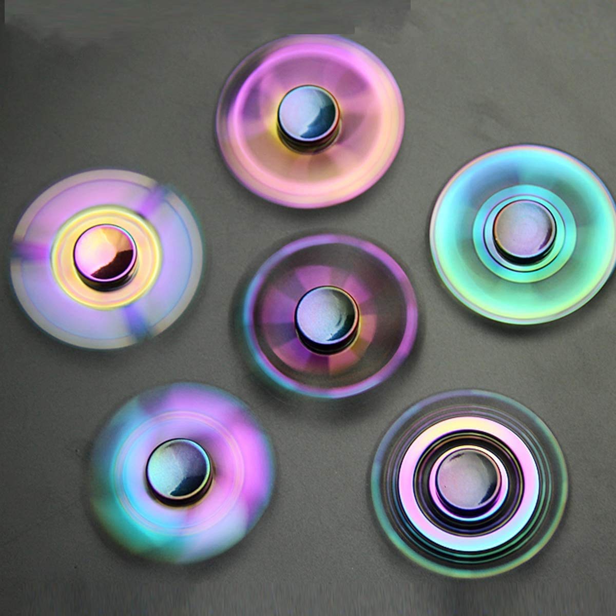 Umnodobn rainbow fidget spinner in green, pocket-sized desk buddy for concentration.
