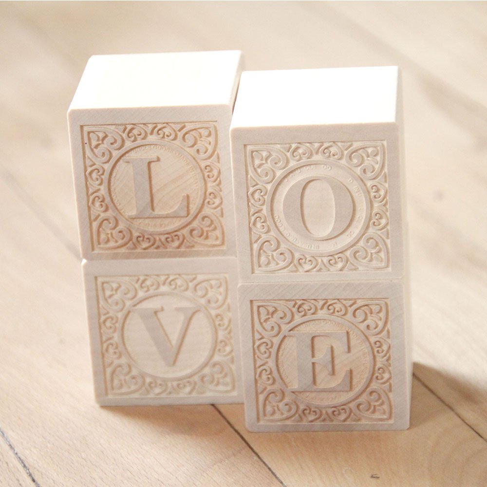 Uncle Goose Alphablank blocks with embossed uppercase letters aid tactile learning