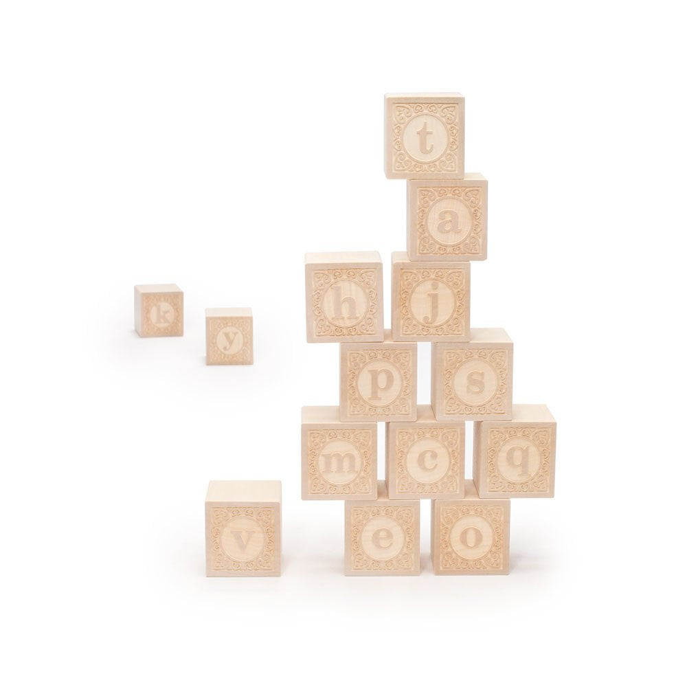 Uncle Goose lowercase alphablank blocks — natural basswood cubes with a/e on opposing faces.