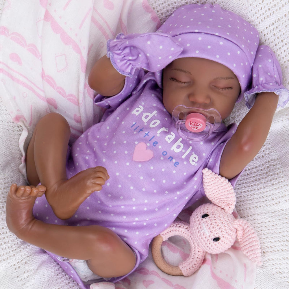 UOFTKIZ black reborn doll with mottled skin for lifelike newborn play and nurturing bonding.