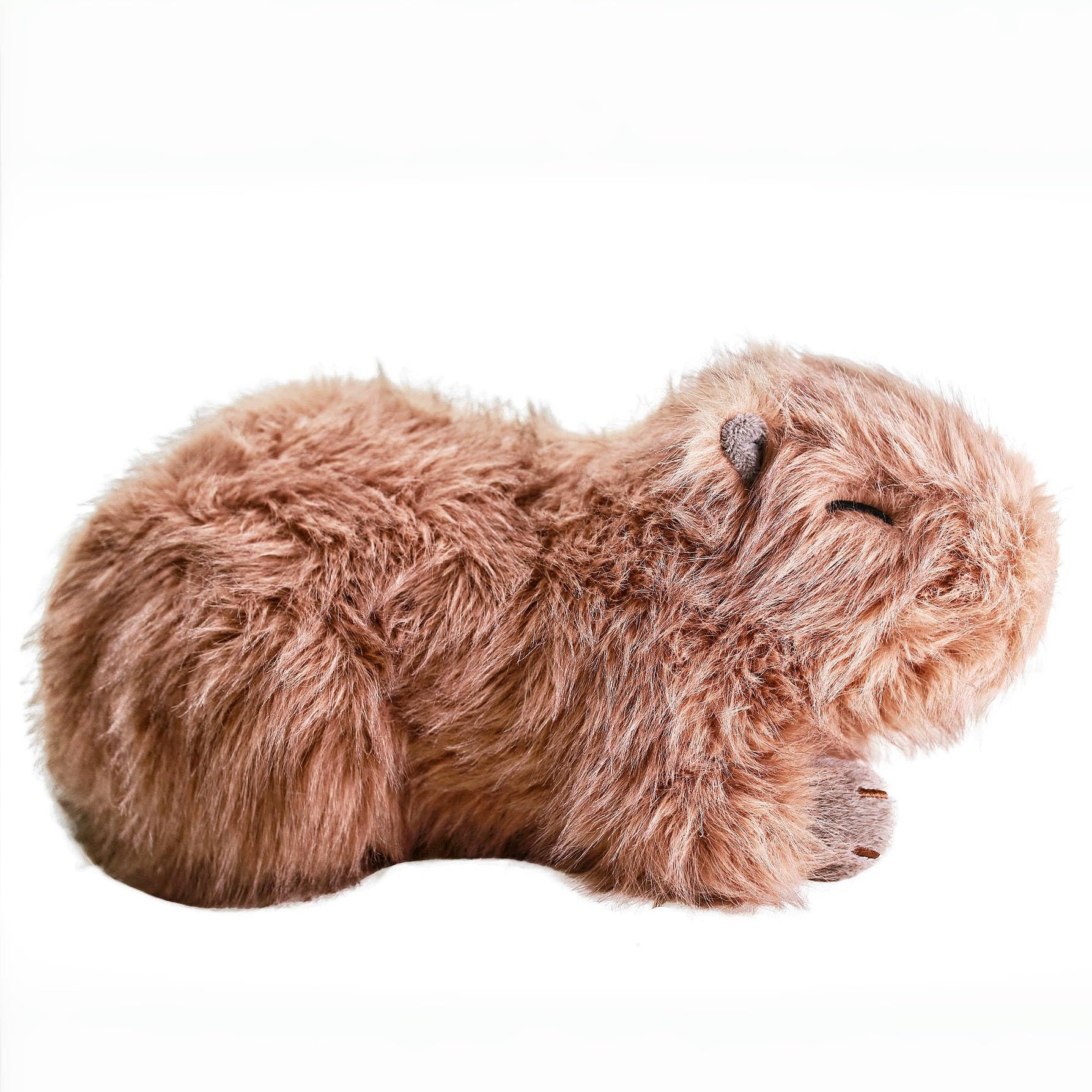uoozii Capybara weighted plush in hand shows 4-pound balance for snug moments