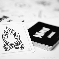 USAOPOLY Dadada teammates competing in a lighthearted language challenge.