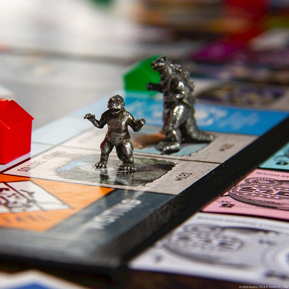 USAOPOLY King Ghidorah token, multi-head kaiju adds strategic flair.