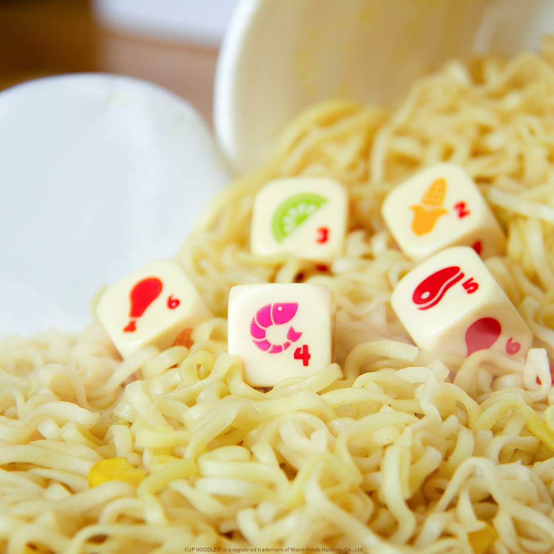 USAOPOLY YAHTZEE Cup Noodles travel-ready game fits backpacks for on-the-go play.