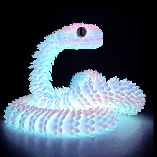 UXBSTM 24in snake toy on desk, a playful desk pet for collectors and fans.