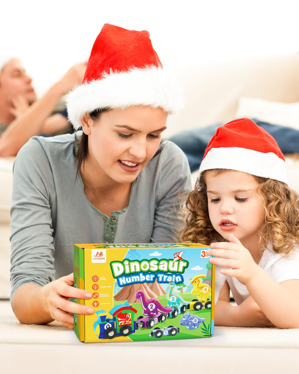 Vanmor toddler playing with the dinosaur-train setup during learning activity.