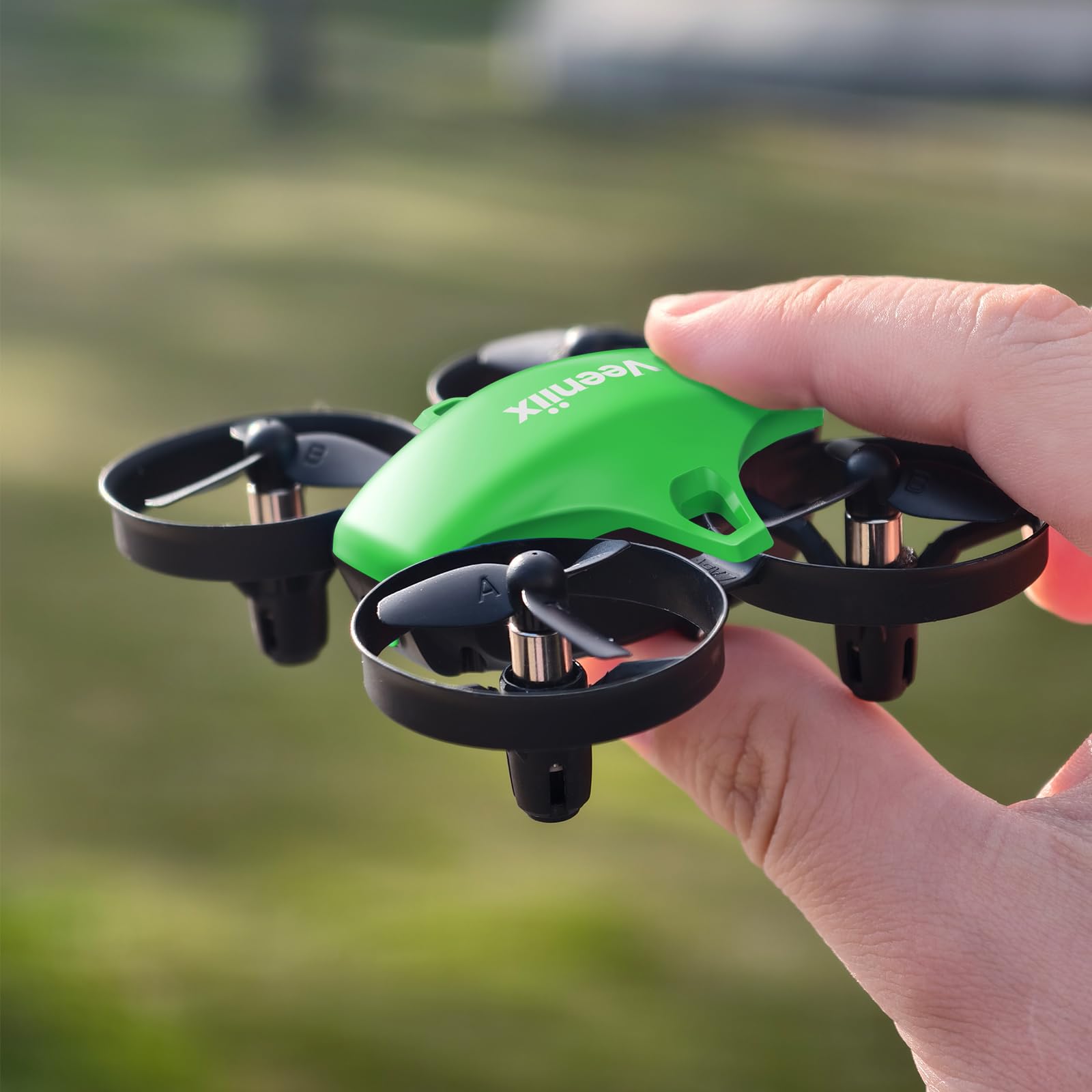 Veeniix V995 mini drone in living room showing steady indoor hover for safe play