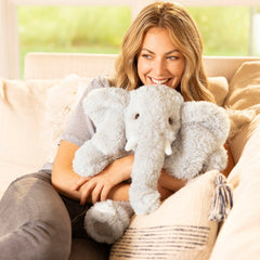 Elephant plush shown as a cozy bedtime cuddle companion.