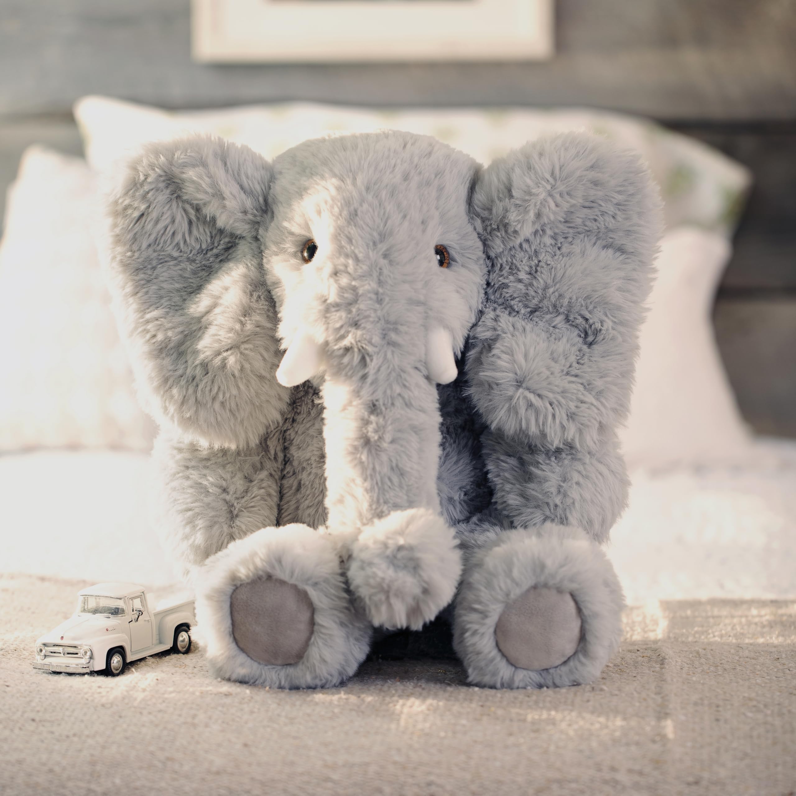 Gift-ready Vermont Teddy Bear Elephant in a warm setting.