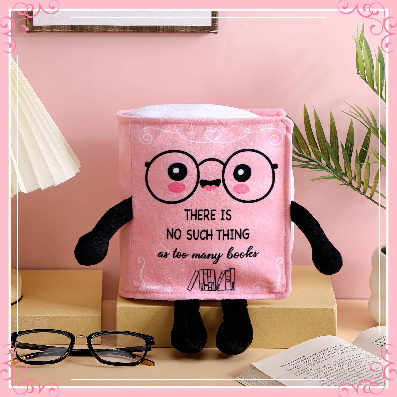 Pink Vertintong plush sits beside novels, adding whimsy to a reading corner.