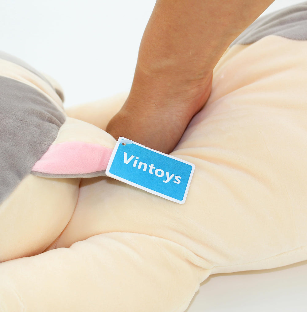 Vintoys Gray Cat Pillow in office chair, ideal for quick naps.