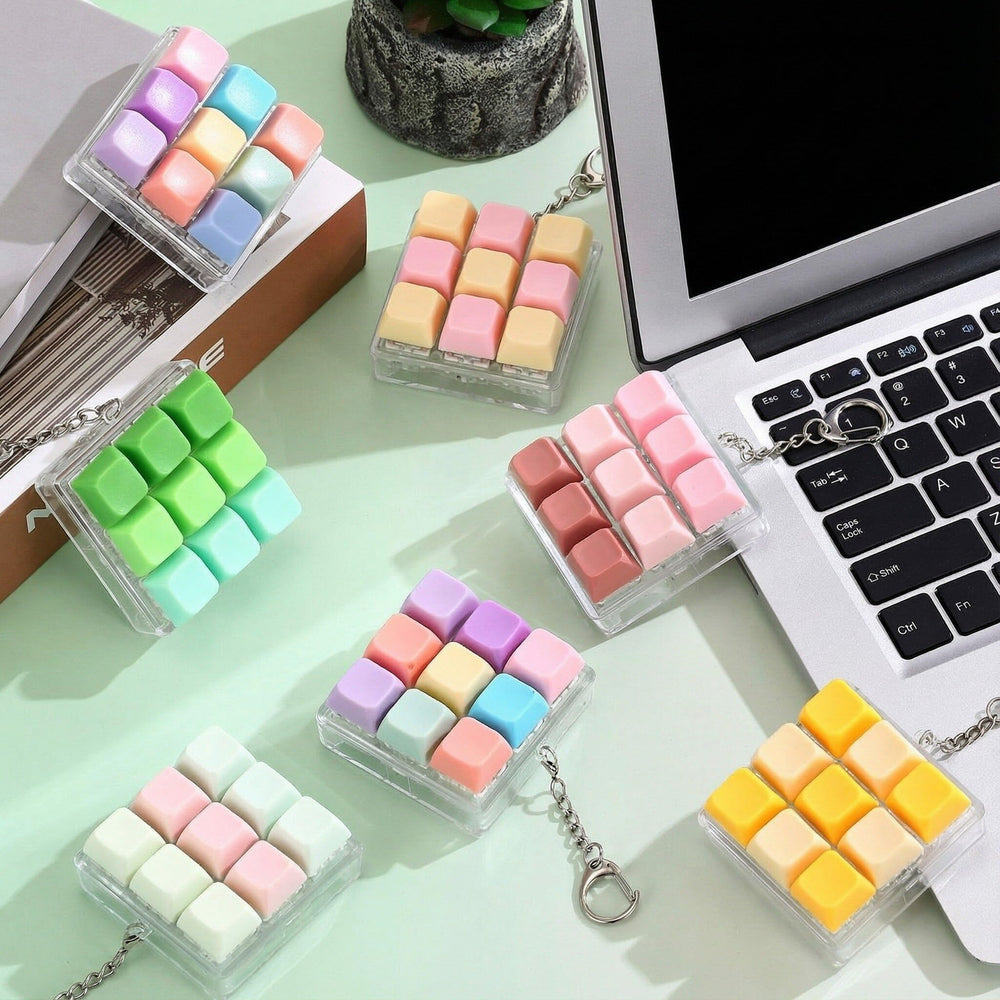 Office desk setup featuring compact, colorful fidget keychains for the workspace.